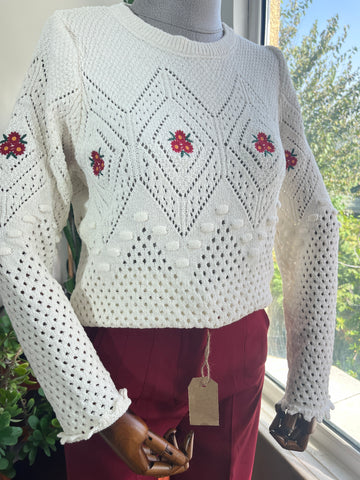 Chic White Crew Neck Sweater with Pom-Pom & Red Flower Details – Cozy & Stylish for Any Occasion